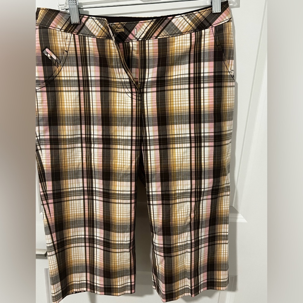 Brand - Cutter & Buck. Size 4. Multi colored long “golfer” shorts - below knee.